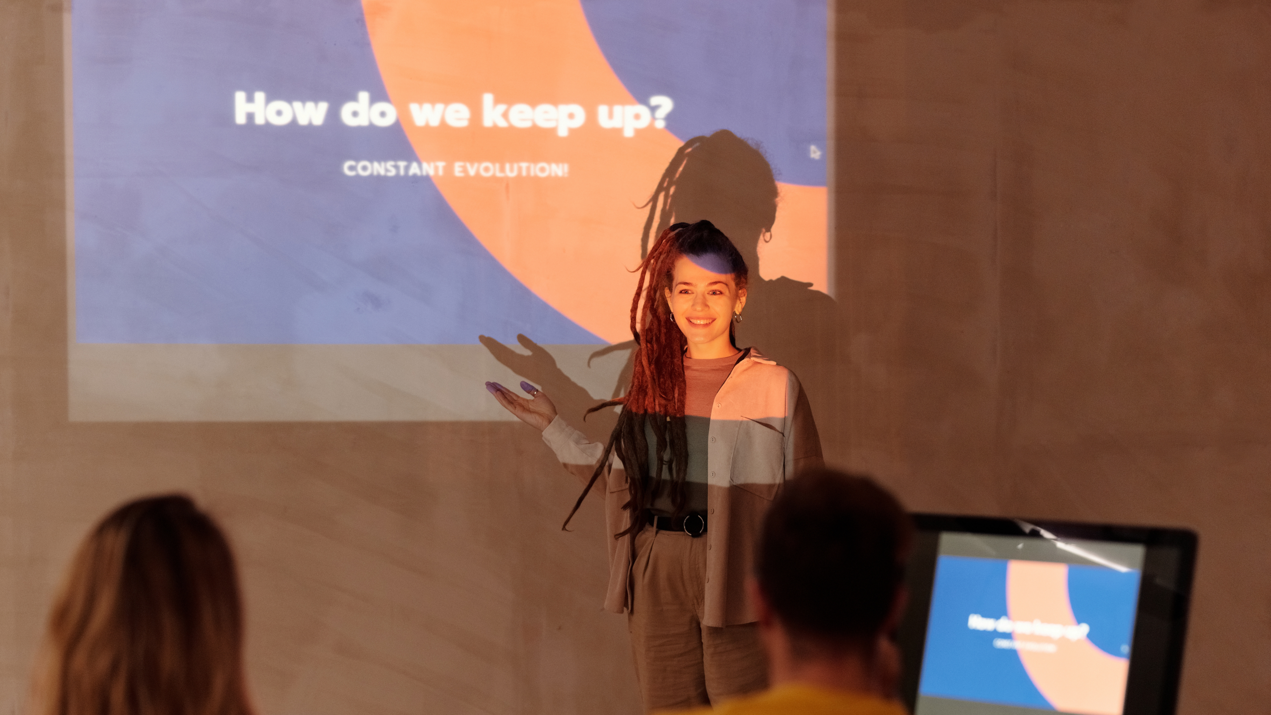 Person presenting slides to a class